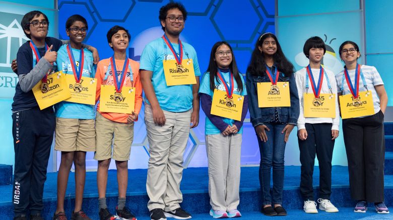 The final eight competitors of the Scripps National Spelling Bee pose for a group photograph after the conclusion of the semifinals, in Oxon Hill, Md., Wednesday, May 29, 2024. These eight spellers will continue on to Thursday night's finals. From left they are, Faizan Zaki, 12, of Allen, Texas, Bruhat Soma, 12, of Tampa, Fla., Shrey Parikh, 12, of Rancho Cucamonga, Calif., Rishabh Saha, 14, of Merced, Calif., Kirsten Tiffany Santos, 13, of Richmond, Texas, Aditi Muthukumar, 13, of Westminster, Colo., YY Liang, 12, of Hartsdale, N.Y., and Ananya Rao Prassanna, 13, Apex, North Carolina.