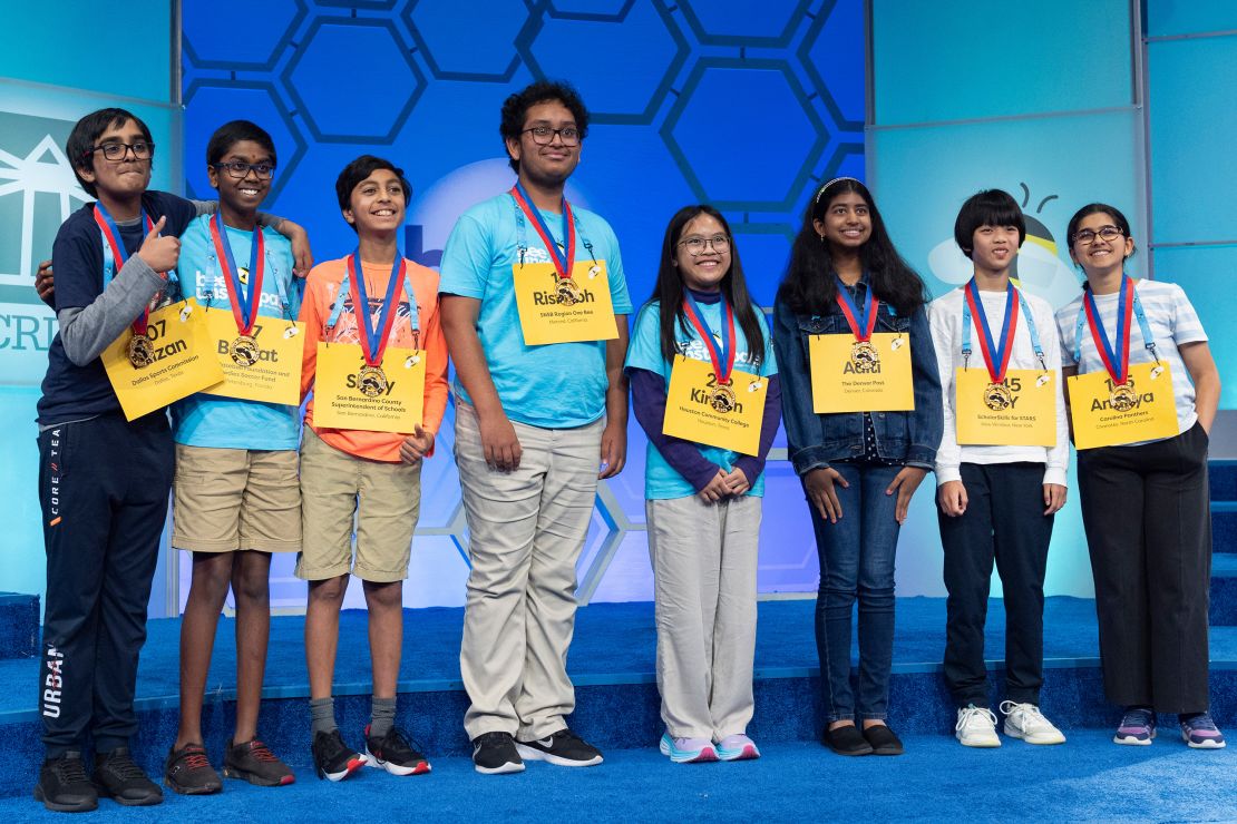 The final eight competitors of the Scripps National Spelling Bee pose for a group photograph after the conclusion of the semifinals on Wednesday.