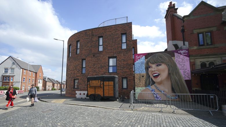 A mural of Taylor Swift on Phoenix Hotel in Liverpool ahead of special artworks being installed in celebration of Taylor Swift's Eras Tour arriving in the city.
