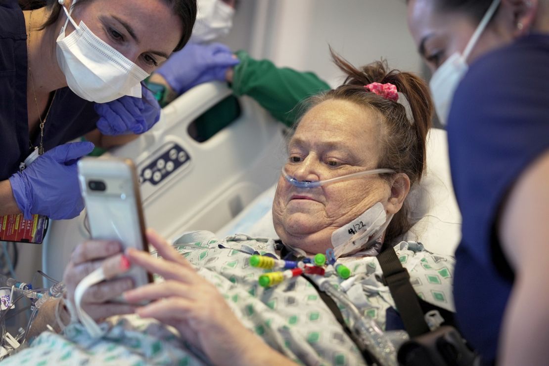 Lisa Pisano looks at photos of her dog after her surgeries at NYU Langone Health in New York on Monday, April 22, 2024.