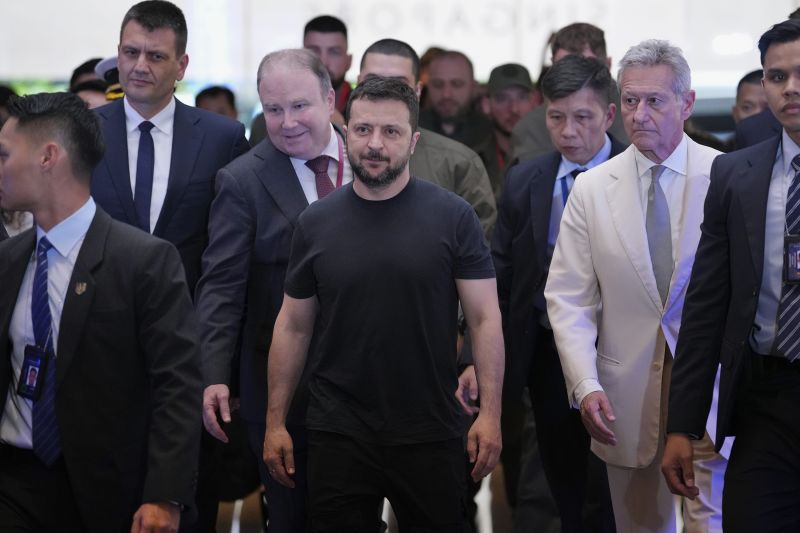 Ukraine’s President Volodymyr Zelenskyy, center, arrives at a hotel, the venue of the 21st Shangri-La Dialogue summit at the Shangri-La Hotel in Singapore, Saturday, June 1, 2024.
