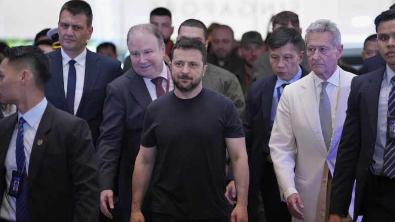 Ukraine’s President Volodymyr Zelenskyy, center, arrives at a hotel, the venue of the 21st Shangri-La Dialogue summit at the Shangri-La Hotel in Singapore, Saturday, June 1, 2024.