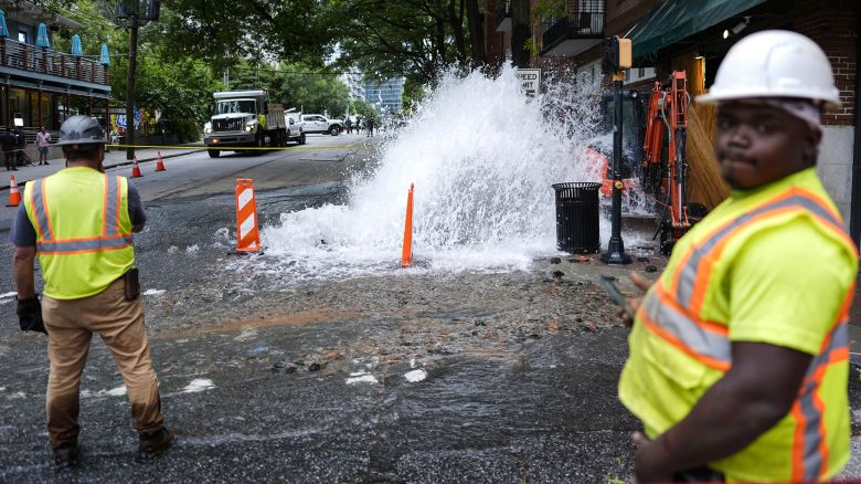 Workers respond Saturday to a broken water transmission in Atlanta.