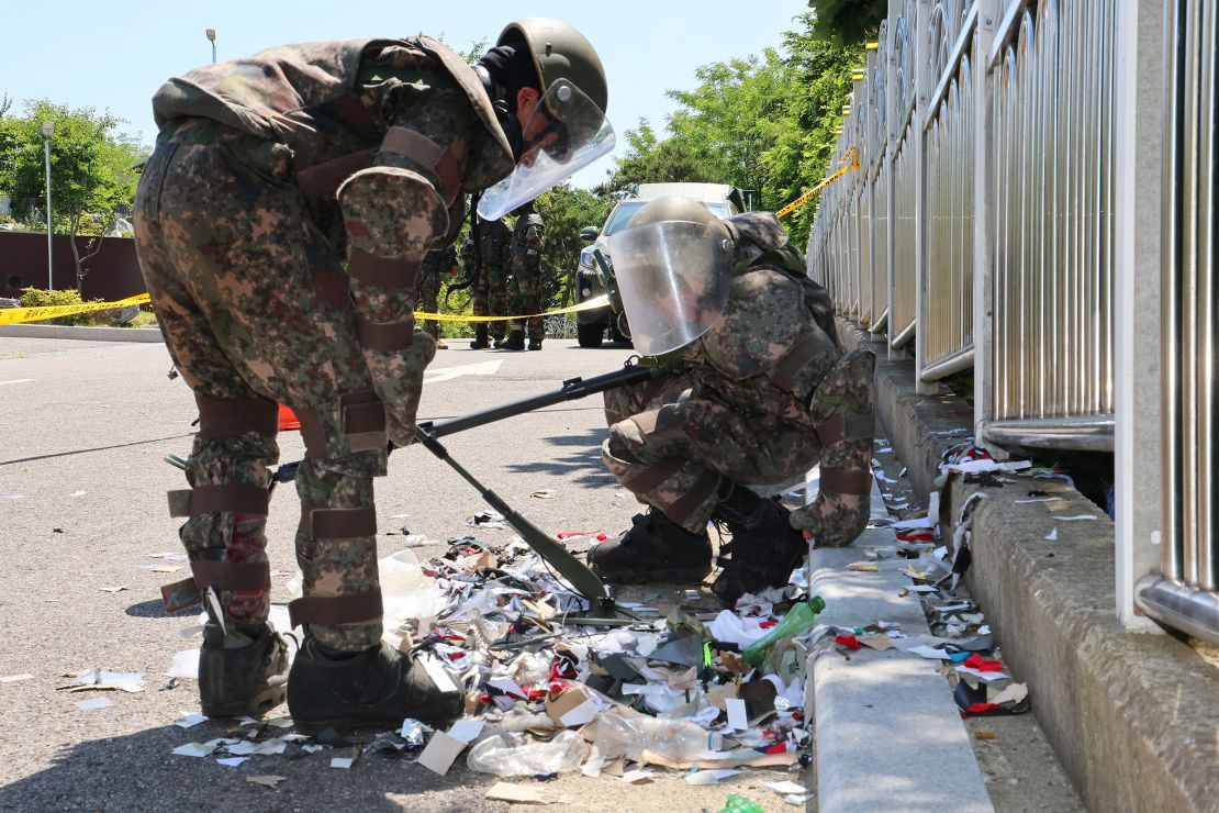 Soldiers inspect debris from a balloon sent by North Korea that landed in Incheon, South Korea.