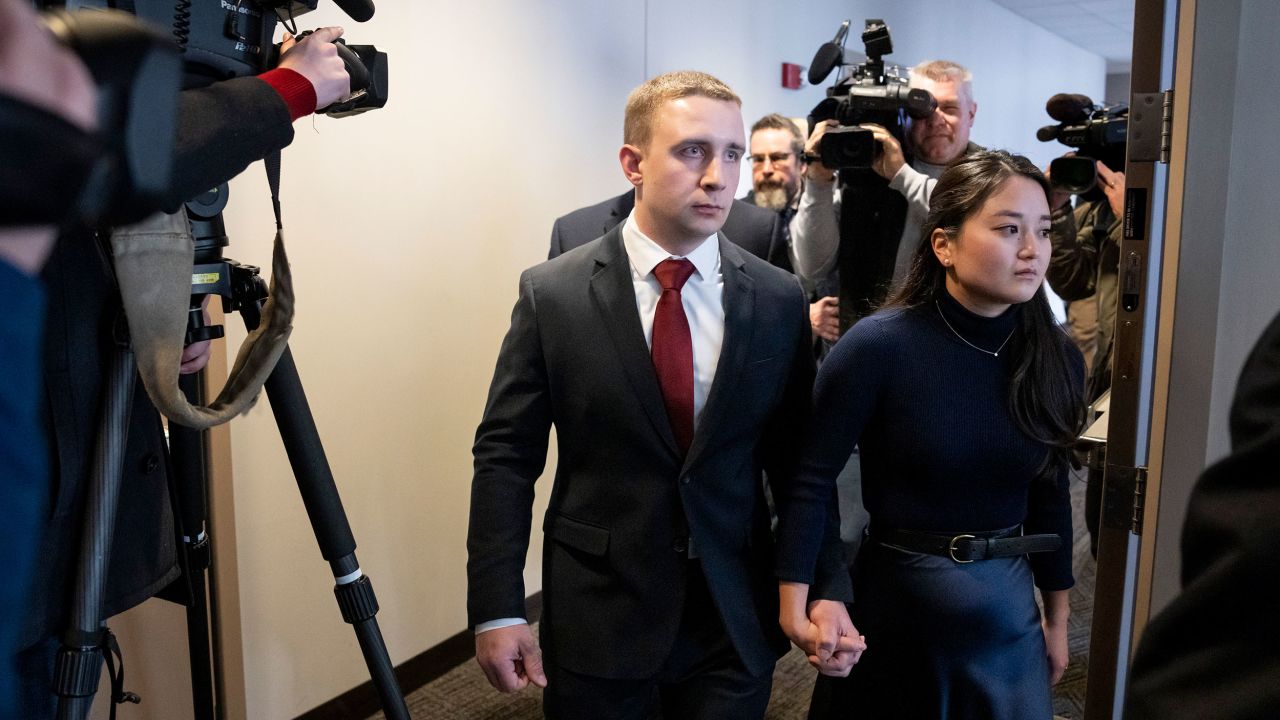 FILE - Trooper Ryan Londregan walks hand-in-hand with his wife to his first court appearance to answer to murder and manslaughter charges in the killing of Ricky Cobb II during a traffic stop last summer, Jan. 29, 2024, at the Hennepin Public Safety Facility in Minneapolis. Prosecutors plan to dismiss murder and manslaughter charges against Londregan, who fatally shot Cobb as he tried to pull away from a traffic stop, saying the unexpected decision comes in response to recent statements from the trooper's attorney and new analysis of video from the scene. (Renée Jones Schneider/Star Tribune via AP, File)