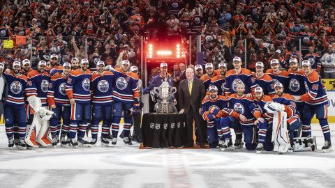 Edmonton Oilers stand with the Campbell Conference Bowl after beating the Dallas Stars in Game 6 of the Western Conference finals of the NHL Stanley Cup playoffs in Edmonton, Alberta, Sunday June 2, 2024. (Jason Franson/The Canadian Press via AP)