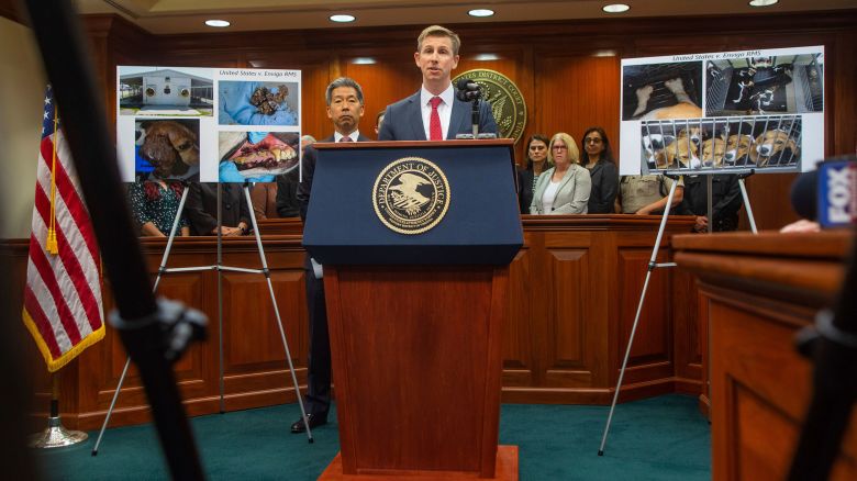 Christopher R. Kavanaugh, U.S. Attorney for the Western District of Virginia, speaks at the podium at the Federal Courthouse in Charlottesville during a press conference where the United States Justice Department discusses the plea agreement reached with Envigo RMS, an animal breeder in Cumberland Va., for $35 Million in an animal welfare case on June 3, 2024. (Cal Cary/The Daily Progress via AP)