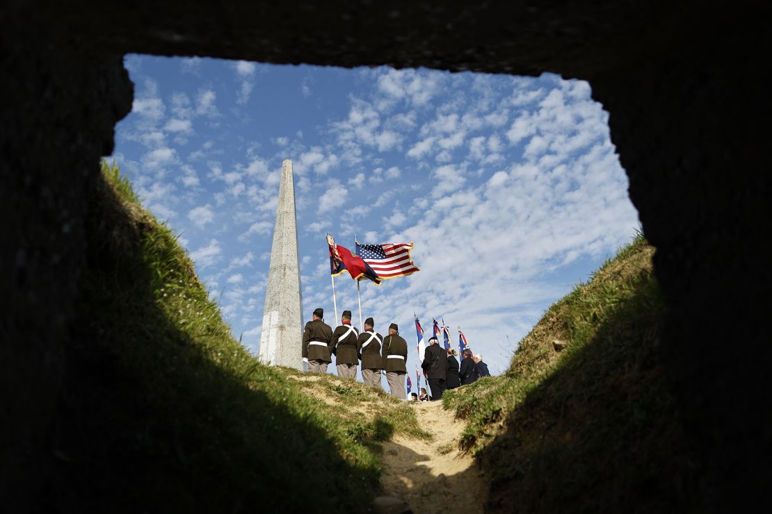 US soldiers attend a wreath-laying ceremony Tuesday at the 1st Infantry Division monument near Omaha Beach.