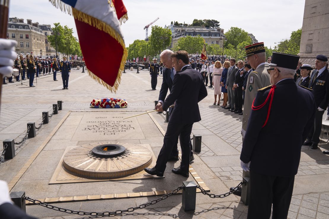 Biden and Macron participate in a ceremony at the Tomb of the Unknown Soldier under the Arc de Triomphe on June 8, 2024.