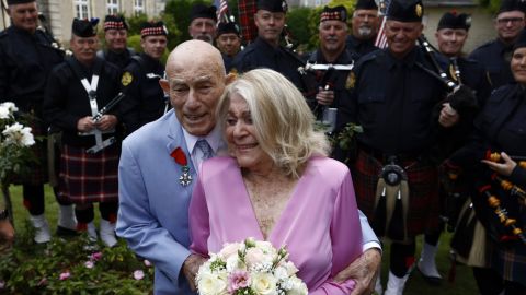 US WWII veteran Harold Terens, 100, left, and Jeanne Swerlin, 96, arrive to celebrate their wedding at the town hall of Carentan-les-Marais, in Normandy, northwestern France, on Saturday, June 8, 2024. Together, the collective age of the bride and groom was nearly 200. But Terens and his sweetheart Jeanne Swerlin proved that love is eternal as they tied the knot Saturday inland of the D-Day beaches in Normandy, France. (AP Photo/Jeremias Gonzalez)