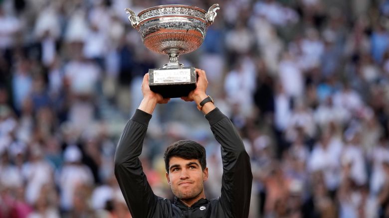 Spain's Carlos Alcaraz holds the trophy after winning the men's final of the French Open tennis tournament against Germany's Alexander Zverev at the Roland Garros stadium in Paris, France, Sunday, June 9, 2024.