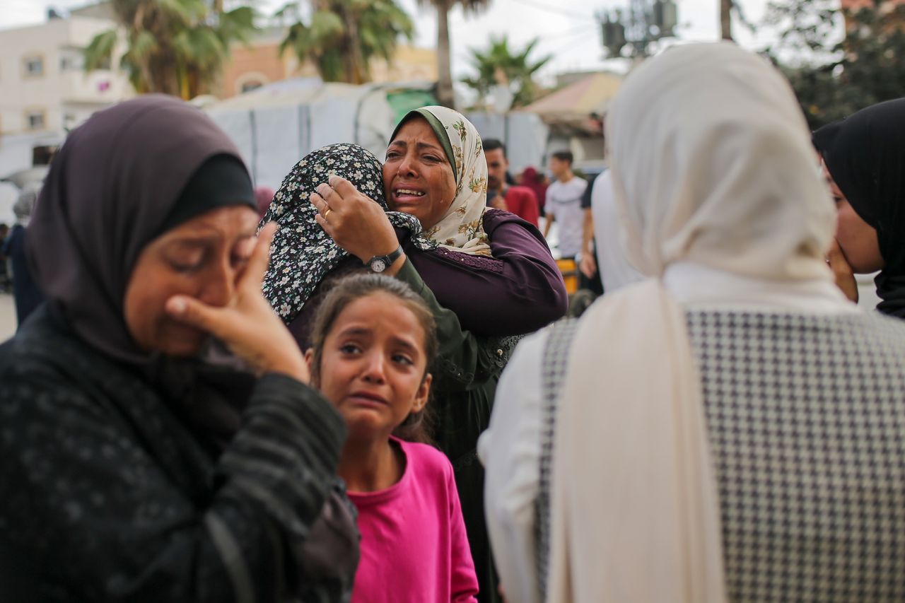 Palestinian women mourn near the bodies of their relatives killed in an Israeli airstrike in June outside the mortuary of the Al-Aqsa Martyrs Hospital in Deir al Balah, Gaza.