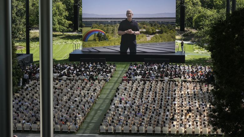 A large screen shows Apple CEO Tim Cook during an announcement of new products on the Apple campus in Cupertino, Calif., Monday, June 10, 2024.
