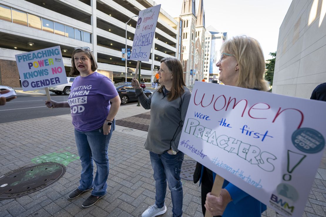 Nikki Hardeman, of Atlanta, an advocacy director for Baptist Women in Ministry, left, Meredith Stone, executive director of Baptist Women in Ministry, center, and Christa Brown, an advocate for survivors of sexual abuse and a supporter of the Baptist Women in Ministry, protest outside the venue of a Southern Baptist Convention annual meeting on June 11, 2024, in Indianapolis.