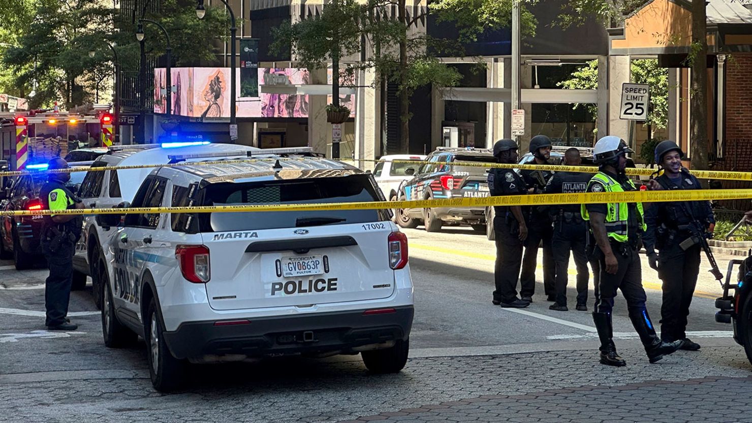 Police respond outside the Peachtree Center complex, on Tuesday, June 11, 2024, in downtown Atlanta.