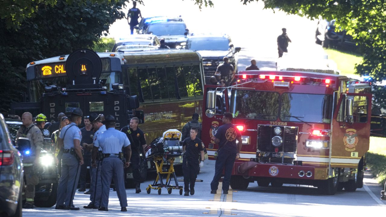 A Gwinnett County, Ga. commuter bus sits in the road where it was stopped in Smoke Rise, Ga., on Tuesday, June 11, 2024. Atlanta police say the transit bus fled from officers responding to a dispute on board, leading them on a wild and lengthty chase into a neighboring county before it was stopped. (AP Photo/Ben Gray)