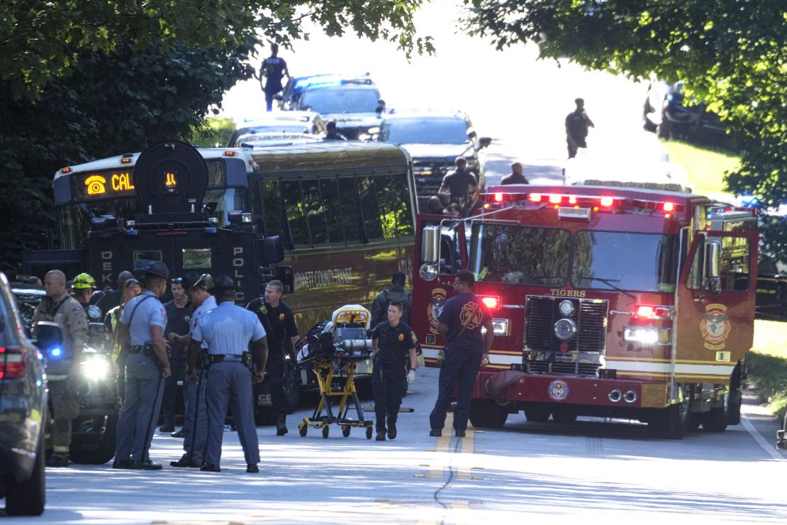 Emergency vehicles surround the hijacked bus after a harrowing chase through two Atlanta-area counties.