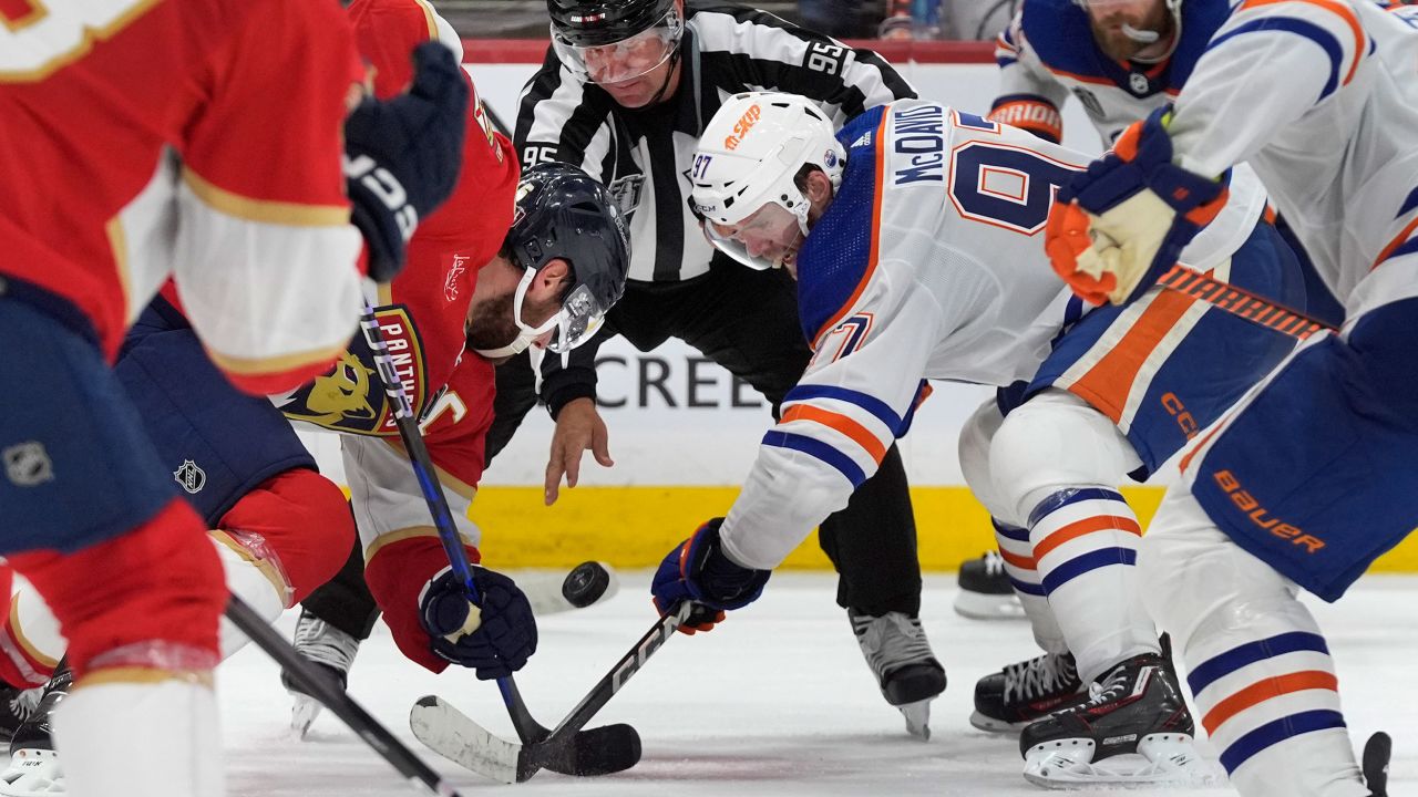 Florida Panthers center Aleksander Barkov (left) and Edmonton Oilers center Connor McDavid (right) face off during Game 1 of the Stanley Cup Final.