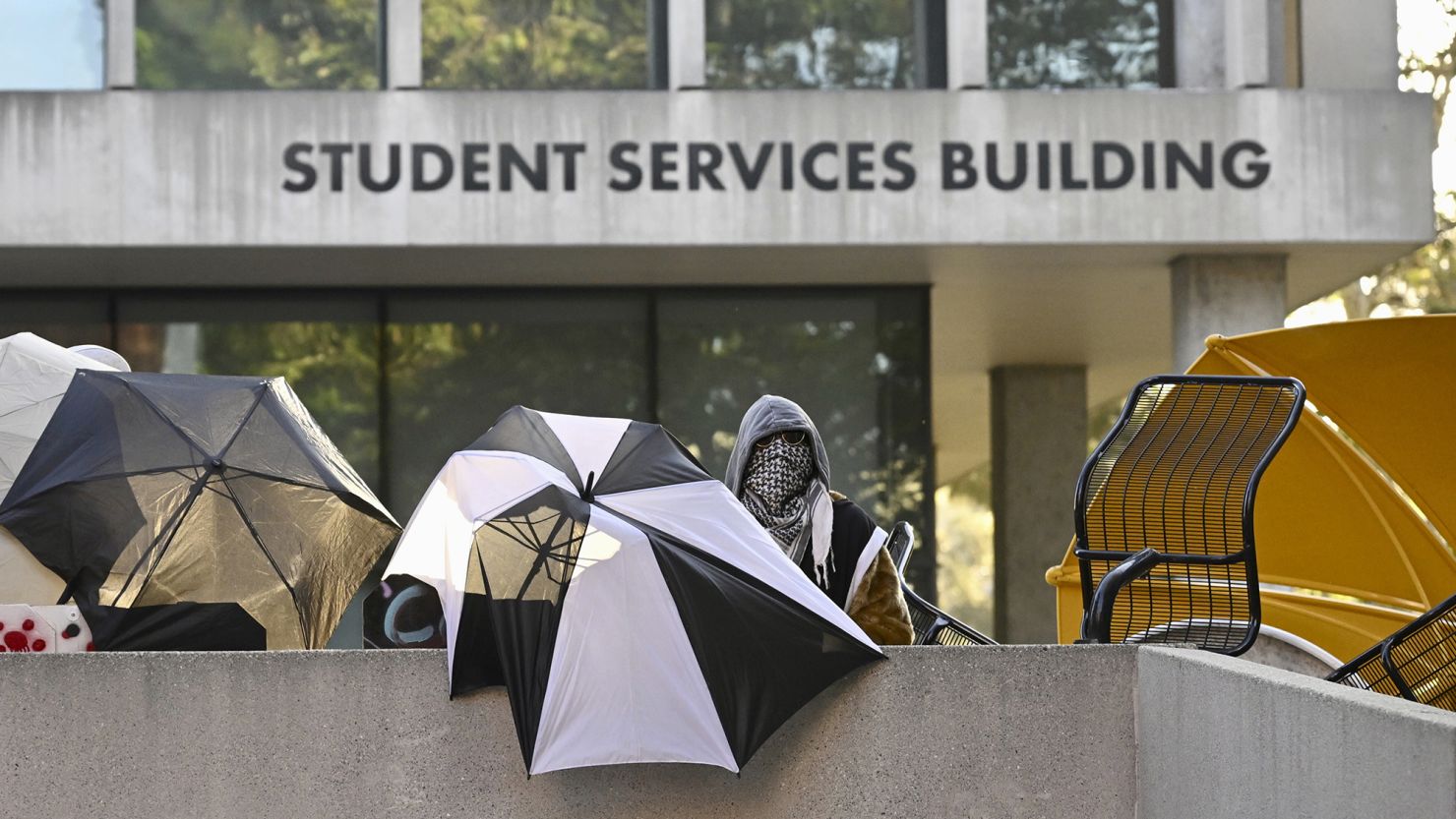 Pro-Palestinian student protesters barricade the entrance to the student services building at California State University, Los Angeles, on Wednesday.