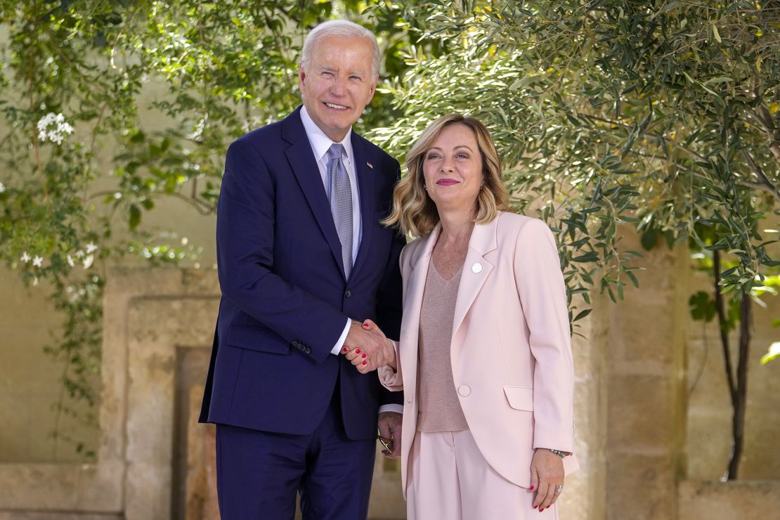 Italian Prime Minister Giorgia Meloni welcomes US President Joe Biden to the G7 summit, June 13, 2024.