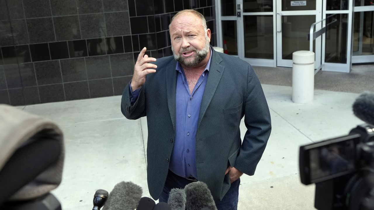 Right-wing conspiracy theorist Alex Jones speaks to the media as he arrives at the federal courthouse for a hearing in front of a bankruptcy judge Friday, June 14, 2024, in Houston.