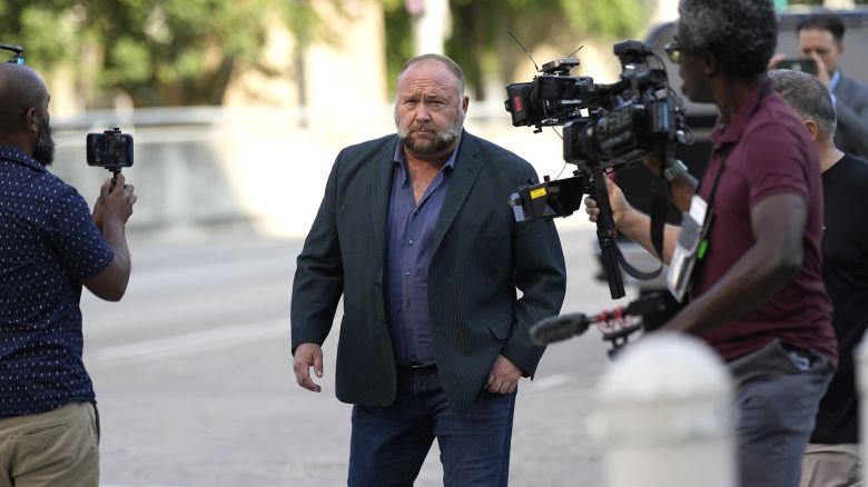 Right-wing conspiracy theorist Alex Jones arrives at the federal courthouse for a hearing in front of a bankruptcy judge Friday, June 14, 2024, in Houston. The judge is expected to rule on whether to liquidate Jones' assets to help pay the $1.5 billion he owes for his false claims that the Sandy Hook Elementary School shooting was a hoax. (AP Photo/David J. Phillip)