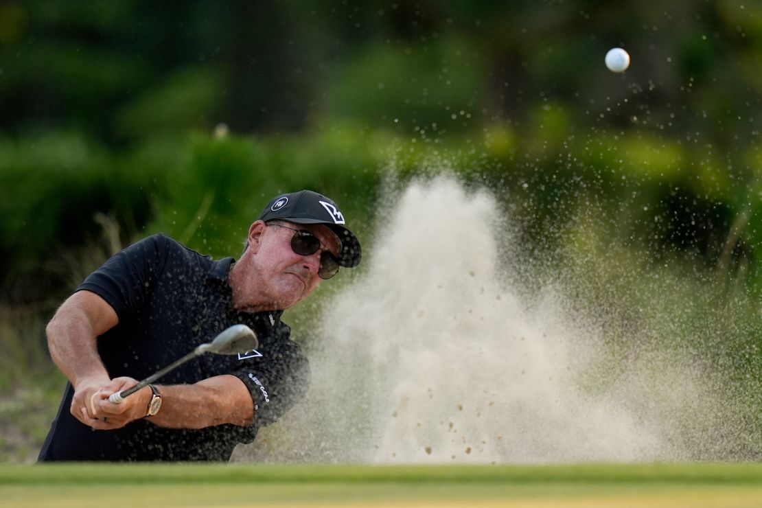 Phil Mickelson hits from the bunker on the ninth hole during the second round.