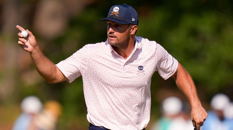 Bryson DeChambeau waves after making a putt on the fifth hole during the third round of the U.S. Open golf tournament Saturday, June 15, 2024, in Pinehurst, N.C. (AP Photo/Frank Franklin II)