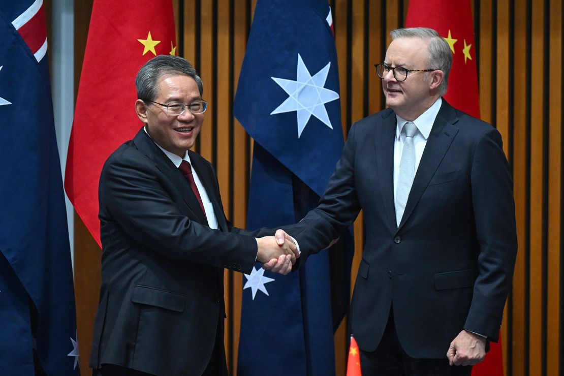 Chinese Premier Li Qiang and Australia's Prime Minister Anthony Albanese shake hands during a signing ceremony in Canberra on June 17.