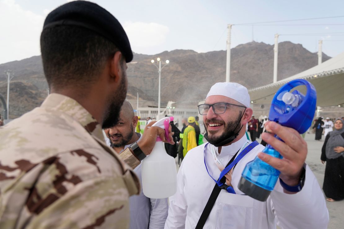 A pilgrim receives cold water spray in Mina near the holy city of Mecca