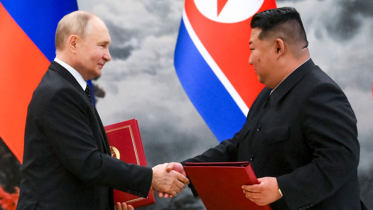Russian President Vladimir Putin and North Korea's leader Kim Jong Un shake hands after a signing ceremony of the new partnership in Pyongyang, North Korea, on June 19, 2024.