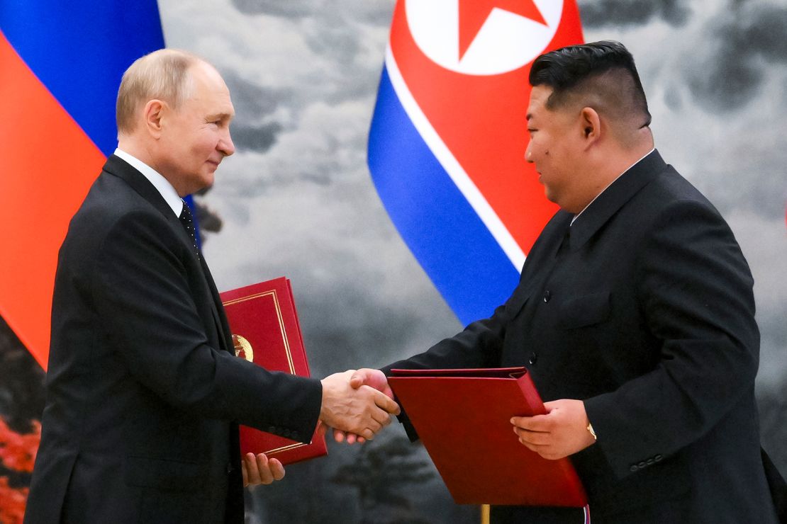 Russian President Vladimir Putin, left, and North Korea's leader Kim Jong Un shake hands after a signing ceremony of the new partnership in Pyongyang, North Korea, on Wednesday, June 19, 2024.