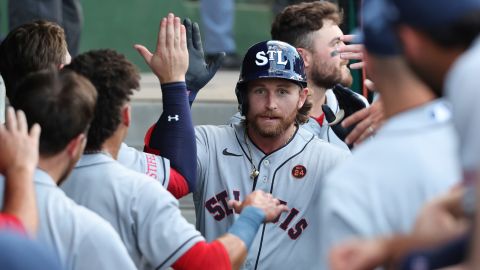 St. Louis Cardinals' Brendan Donovan is congratulated by teammates in the dugout after hitting a two-run home run during a game against the San Francisco Giants at Rickwood Field, in Birmingham, Alabama on June 20, 2024.