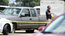 Law enforcement officers work the scene of a shooting at the Mad Butcher grocery store in Fordyce, Ark., Friday, June 21, 2024.