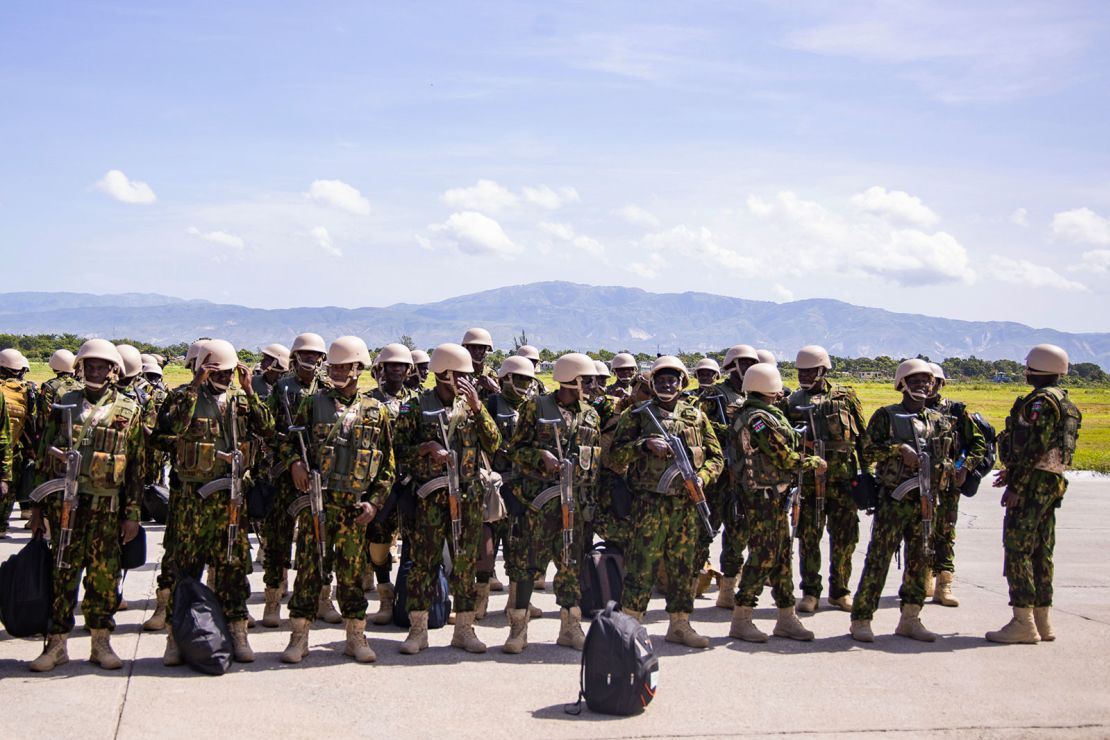 Police from Kenya stand at the Toussaint Louverture International Airport after landing in Port-au-Prince, Haiti, on June 25, 2024.