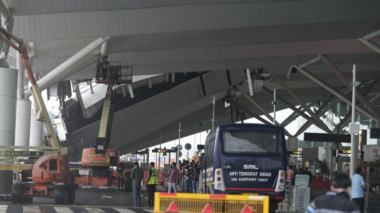 A crew inspects the damage to part of the roof at New Delhi’s Indira Gandhi International Airport that collapsed following heavy rains on Friday, June 28, 2024.