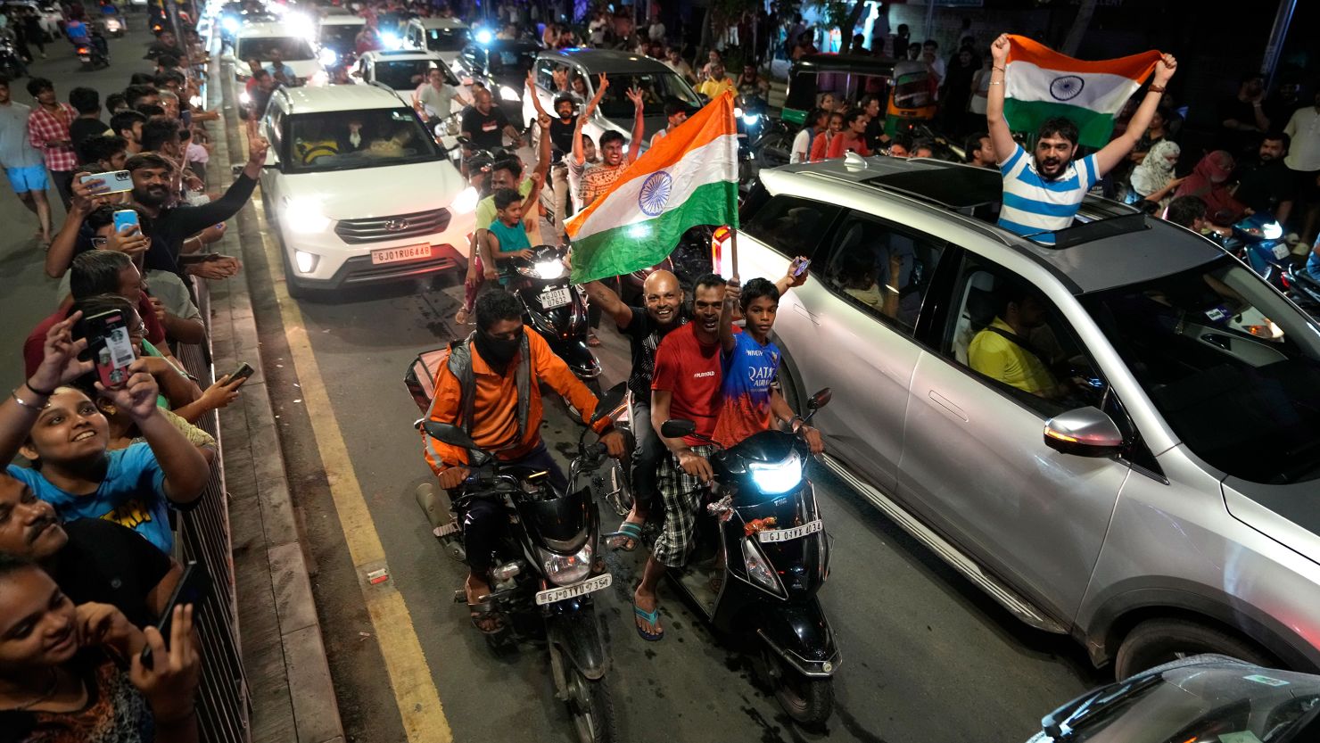 Cricket fans celebrate on the streets after India won the men's T20 World Cup final.