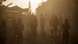 Palestinians displaced by the Israeli bombardment of the Gaza Strip walk through a street market in Khan Younis, southern Gaza Strip Saturday, June 29, 2024. (AP Photo/Jehad Alshrafi)