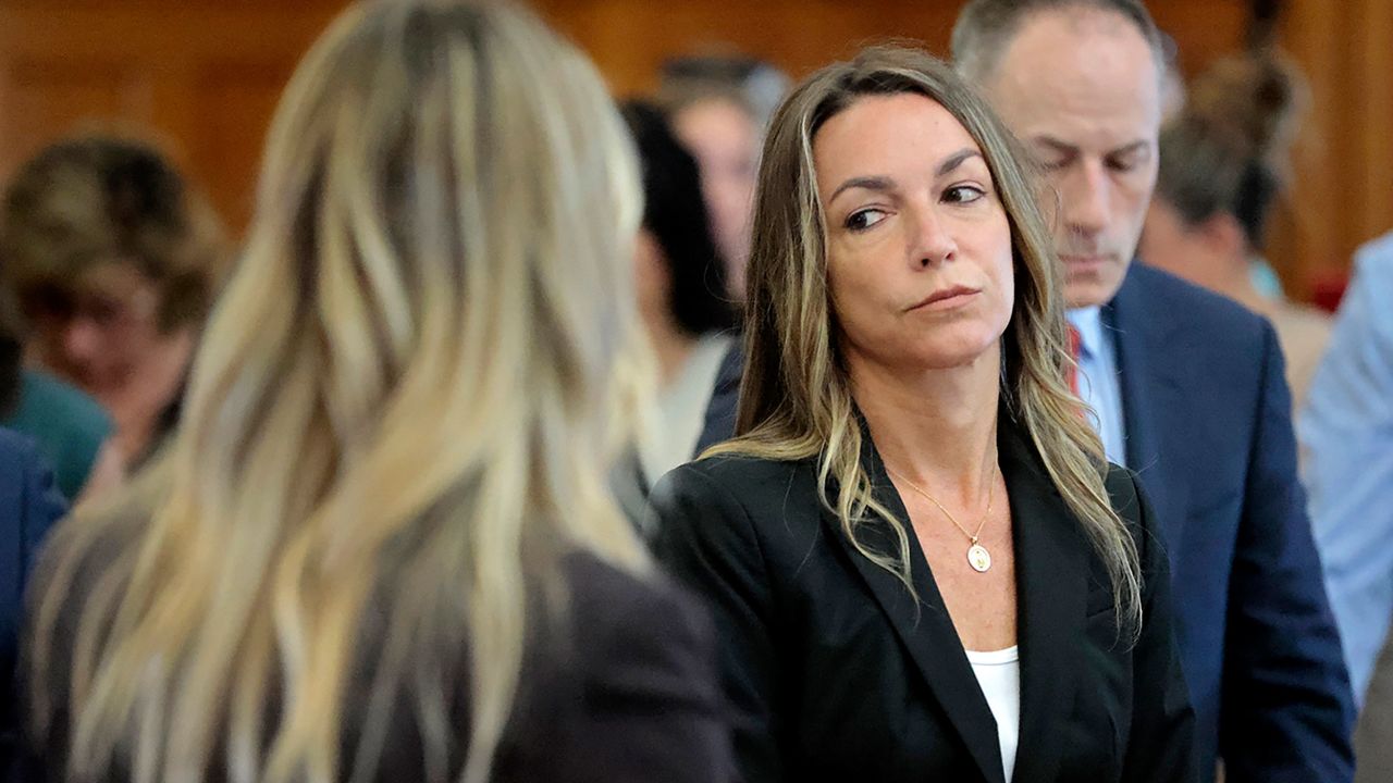 All stand as the jury files out to the courtroom, to start their fifth day of deliberations in the murder trial for Karen Read in Norfolk Superior Court in Dedham, Mass., Monday, July 1, 2024. (Pat Greenhouse/The Boston Globe via AP, Pool)