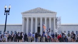 Protesters gather outside the Supreme Court on July 1, 2024,  the day of its historic ruling on presidential immunity.