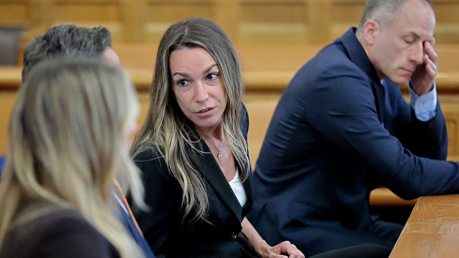 Karen Read talks Monday with her legal team at the Norfolk Superior Court in Dedham, Massachusetts.