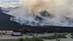 This photo provided by the National Park Service shows a wildfire burning about a mile north of Denali National Park and Preserve, Alaska, on June 30, 2024, as seen from a tourist area outside the park that's home to hotels, gift shops and restaurants.