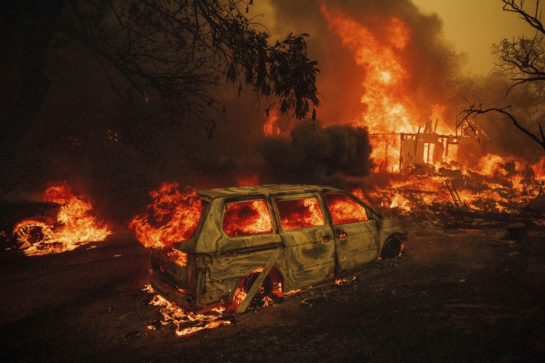 Wildfire flames engulf a home in Oroville, California, on July 2.