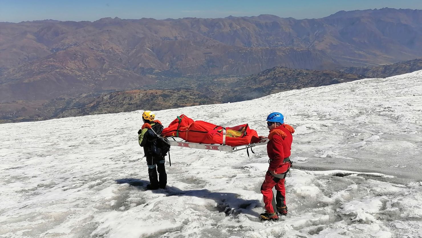 Police carry a body identified as US mountain climber Bill Stampfl, on Mount Huascaran in Huaraz, Peru, on July 5, 2024.