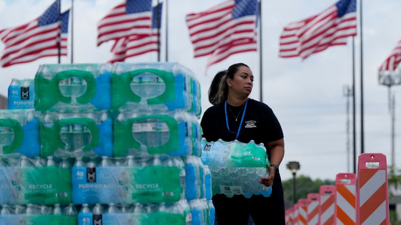 Staff at Lakewood Church hand out water and operate a cooling station in Houston, on July 9.