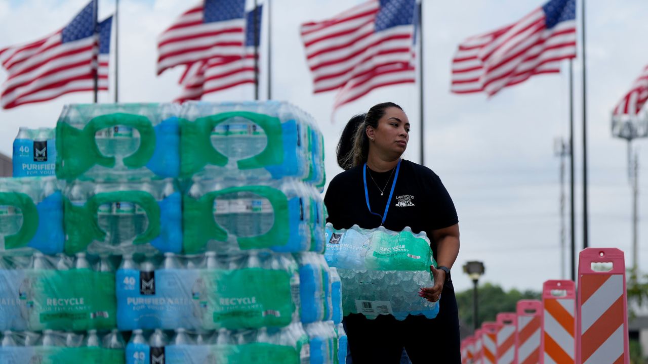 Staff at Lakewood Church hand out water and operate a cooling station in Houston, on July 9.