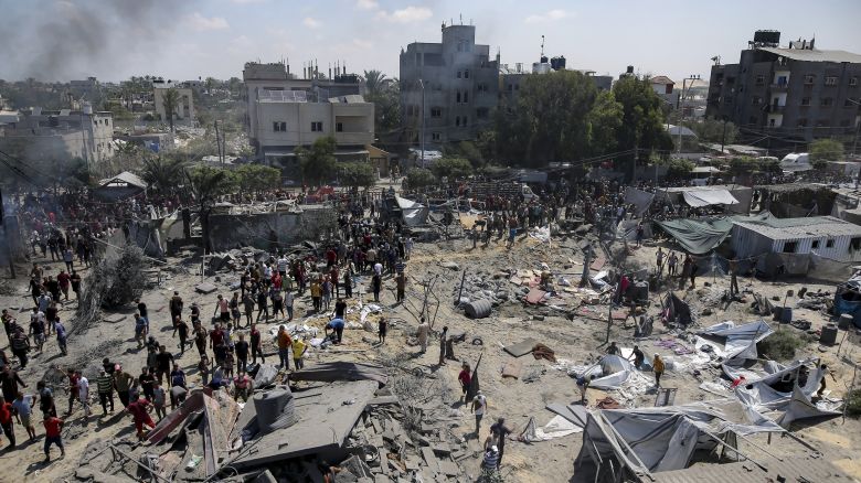 Palestinians inspect the damage at a site hit by an Israeli bombardment on Khan Younis on Saturday.