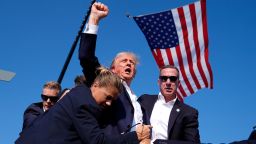 Donald Trump is surrounded by US Secret Service agents at a campaign rally on July 13 in Butler, Pennsylvania.