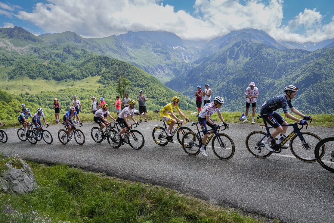 Pogačar wears the yellow jersey during this year's Tour, trailing Vingegaard in the polka dot jersey.