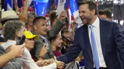 Republican vice presidential candidate Sen. JD Vance, R-Ohio, greets delegates as he arrives on the floor during the first day of the 2024 Republican National Convention at the Fiserv Forum, Monday, July 15, 2024, in Milwaukee.